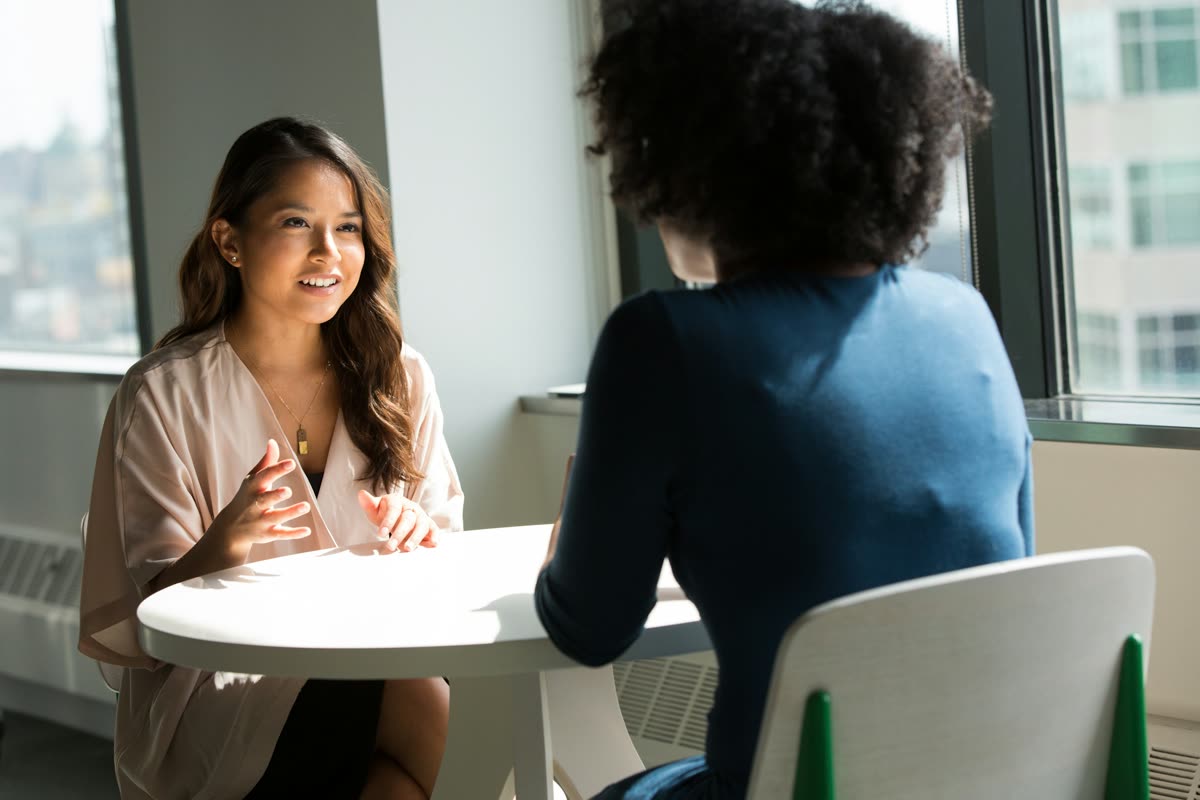 Two people in conversation at home